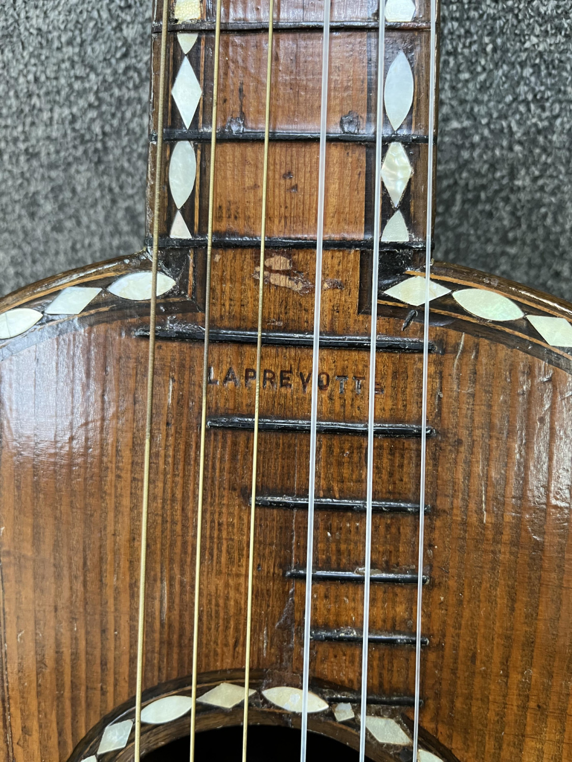 Stamped Laprevotte twice, over the end block and at the 13th Fret